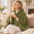 Woman relaxing on the sofa in a Khaki green heated shawl wrap